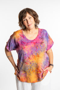 Betty is wearing a size Large batik tunic in Watermelon