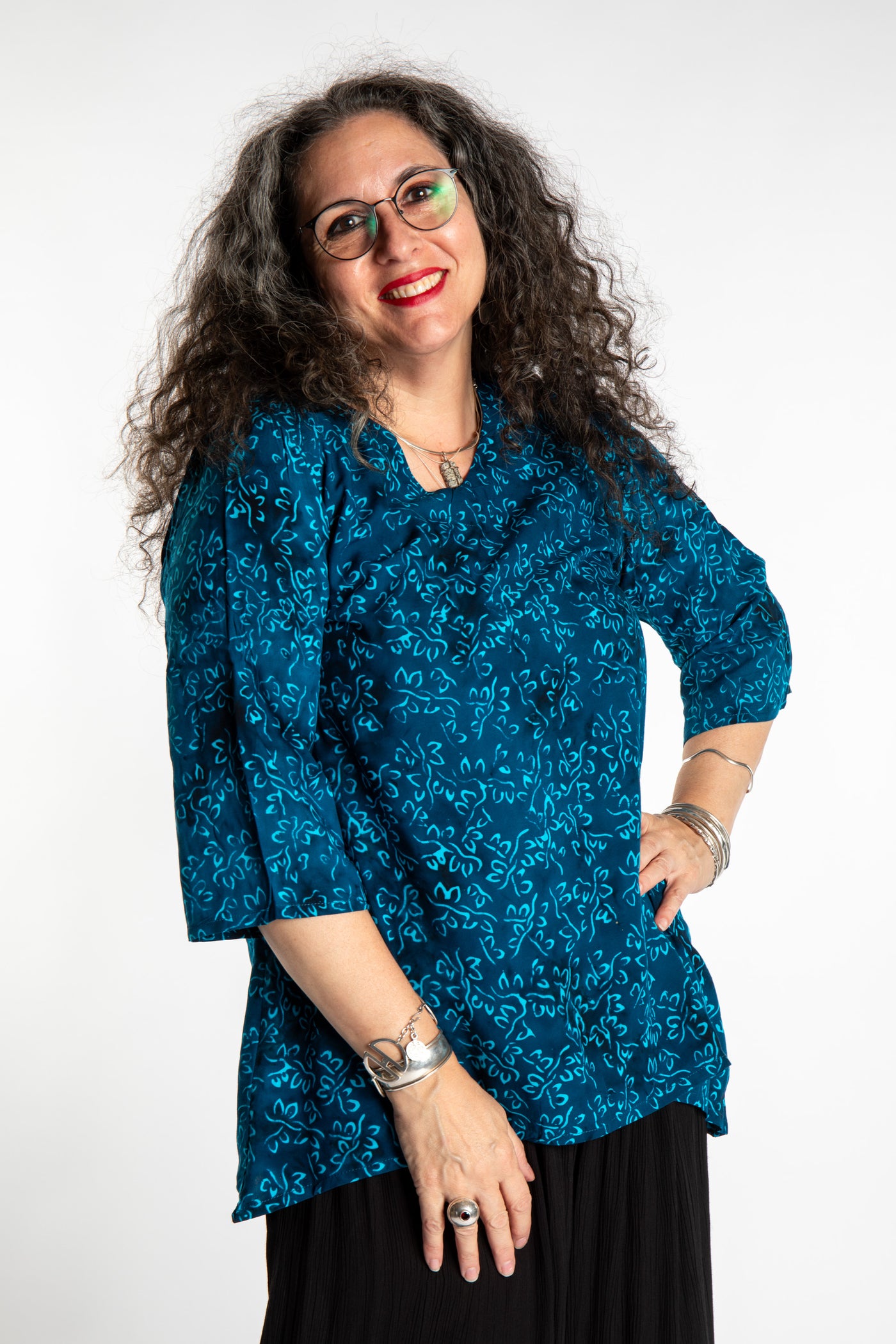 Susan wearing the M/L Deep Azure blue floral batik tunic top