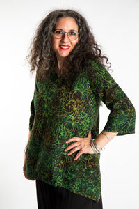 Susan wearing the M/L Emerald Green floral batik tunic top