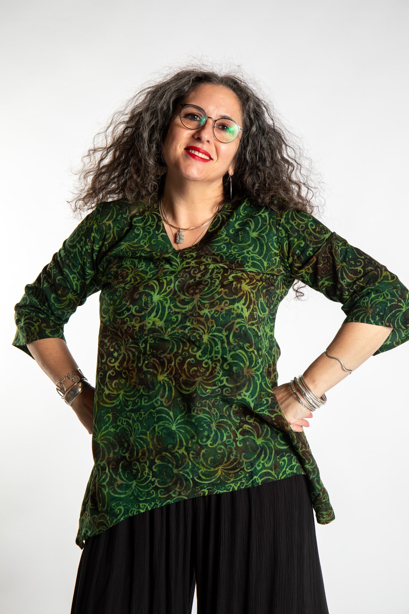 Susan wearing the M/L Emerald Green floral batik tunic top