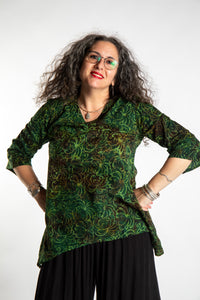 Susan wearing the M/L Emerald Green floral batik tunic top