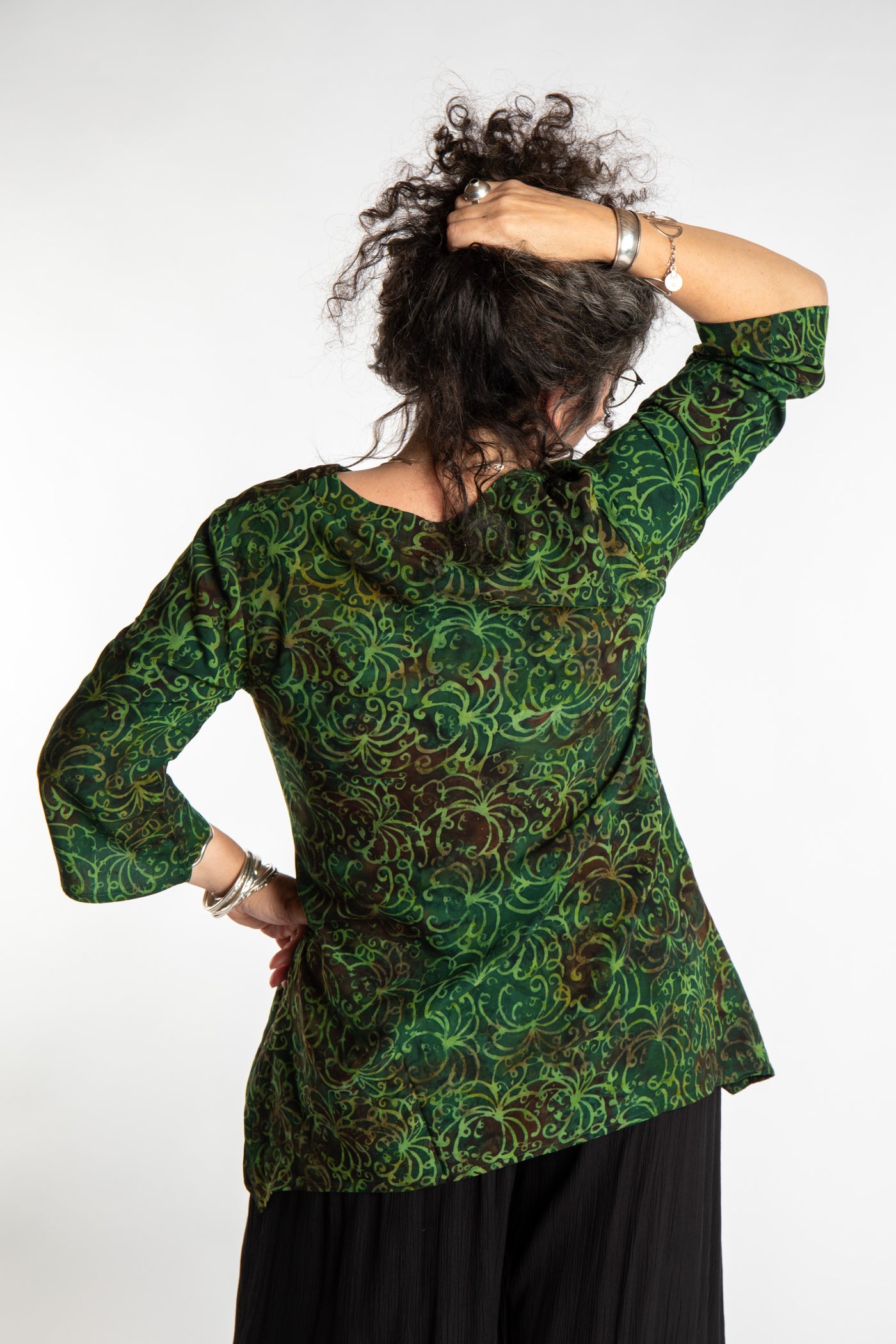 Susan wearing the M/L Emerald Green floral batik tunic top
