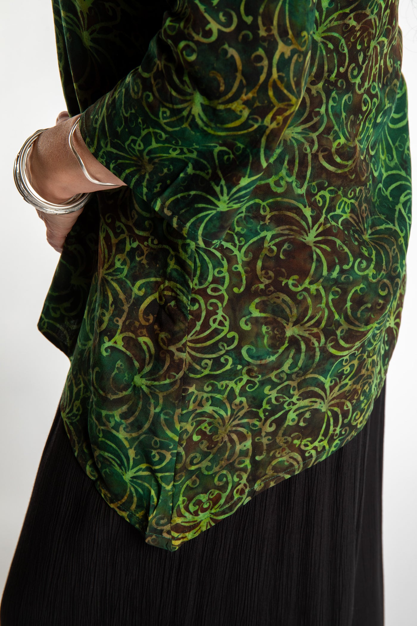 Susan wearing the M/L Emerald Green floral batik tunic top