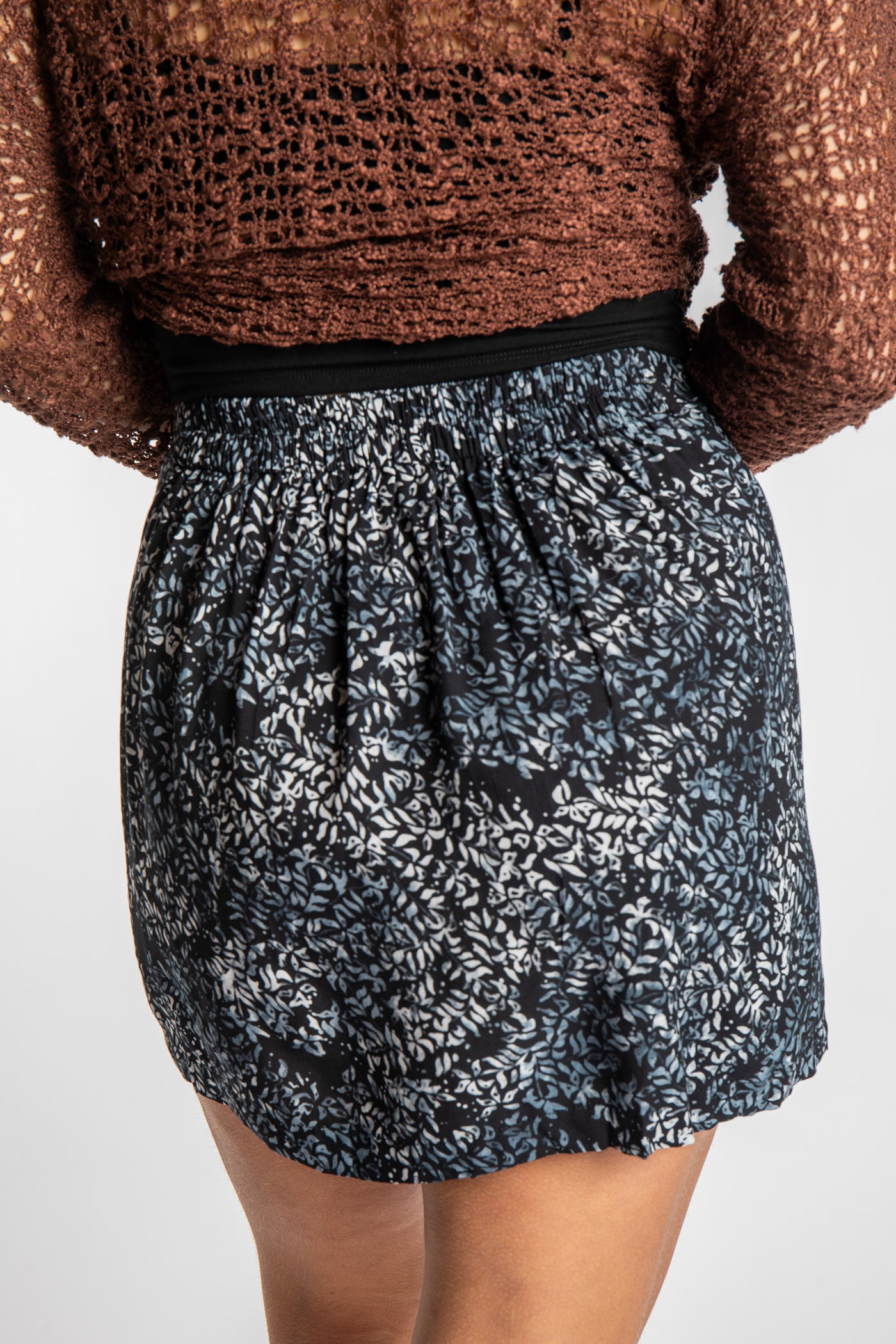 Sophie is wearing the Black Vines Juna Batik Pencil Skirt in size S/M