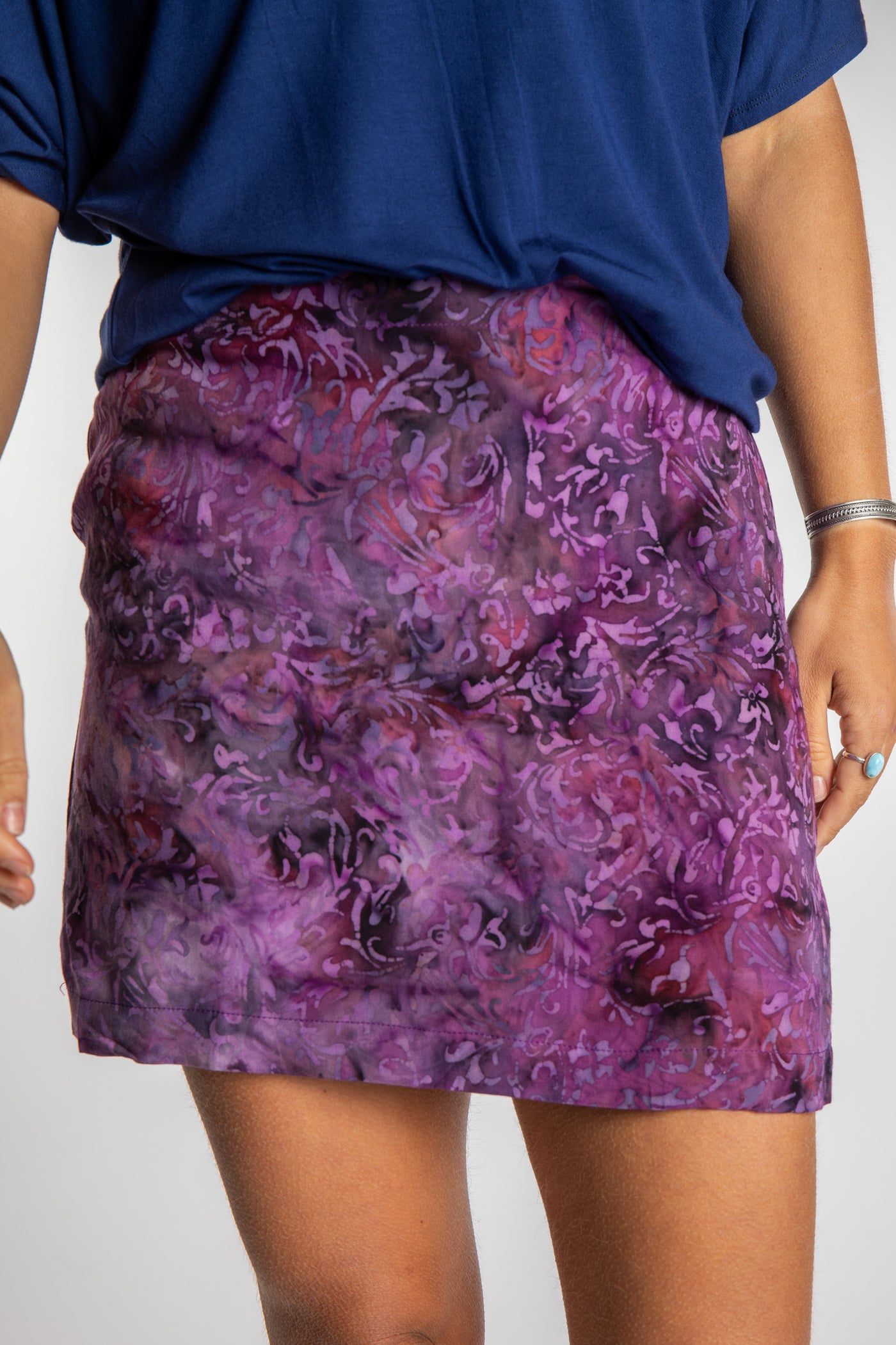 Sophie is wearing the Fantasy Purple Juna Batik Pencil Skirt in size S/M