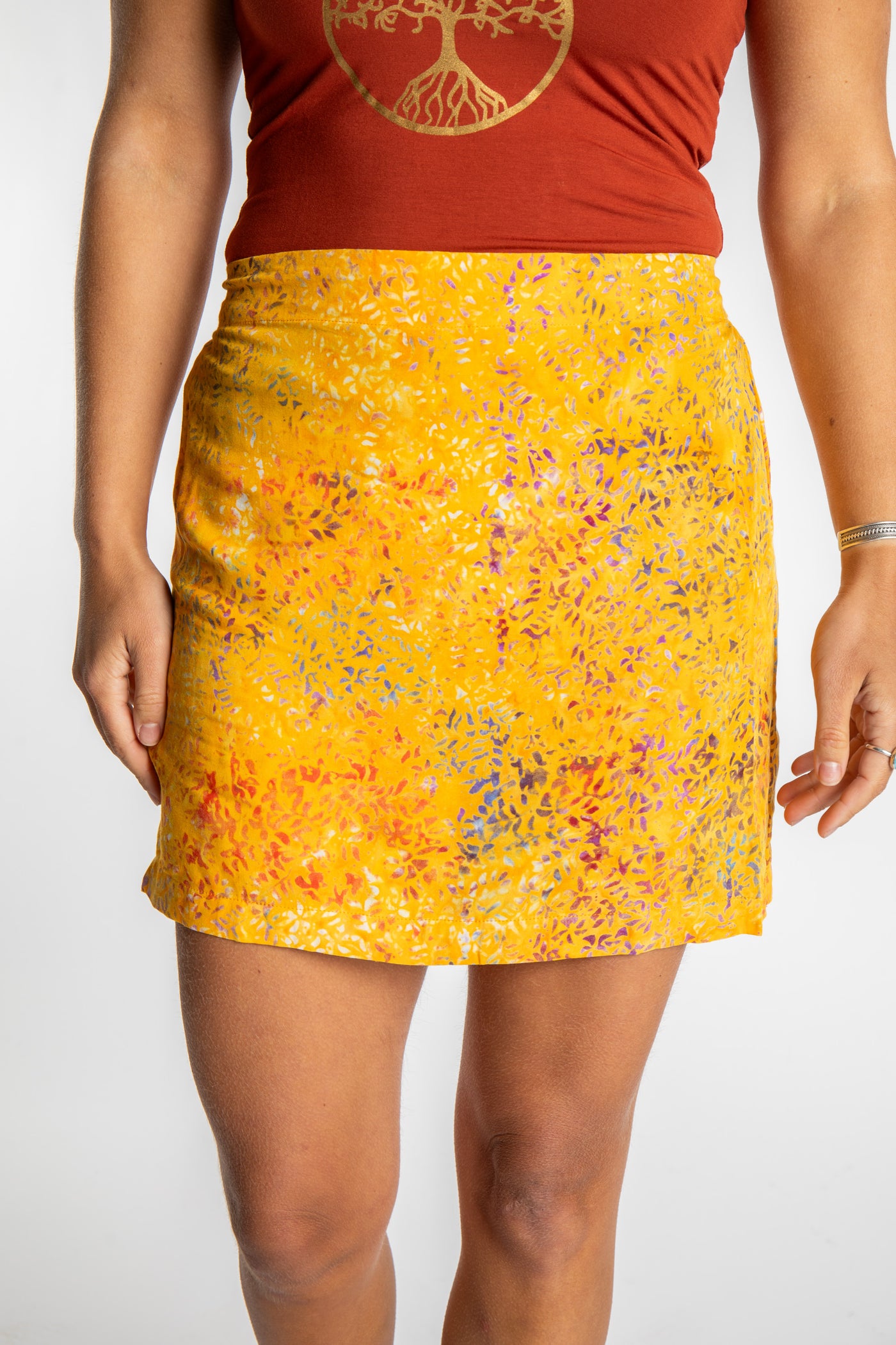 Sophie is wearing the Sunshine Yellow Juna Batik Pencil Skirt in size S/M