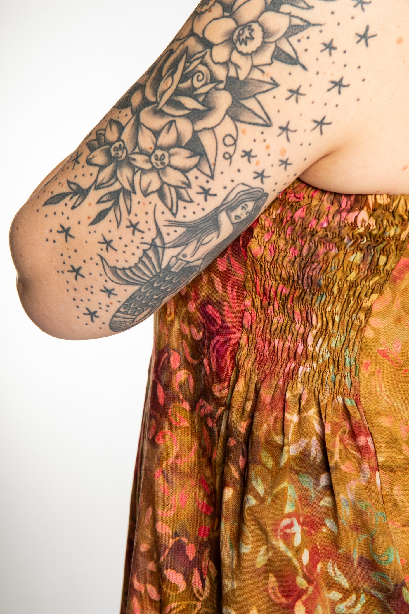 Morgan is wearing the Amber Surya Batik Sundress in size M 