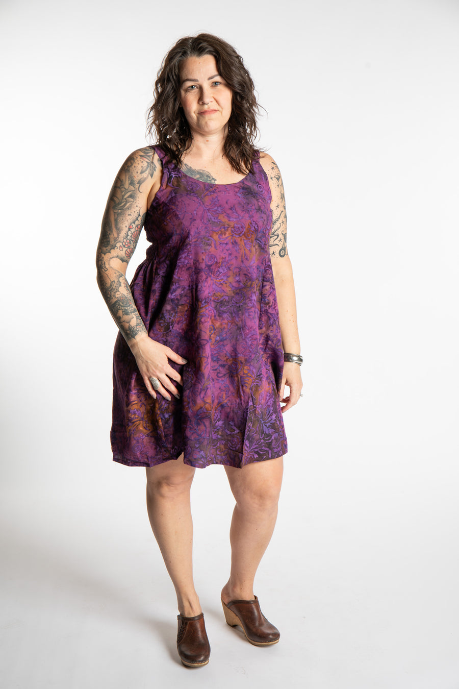 Morgan is wearing the Purple Paradise Surya Batik Sundress in size M 