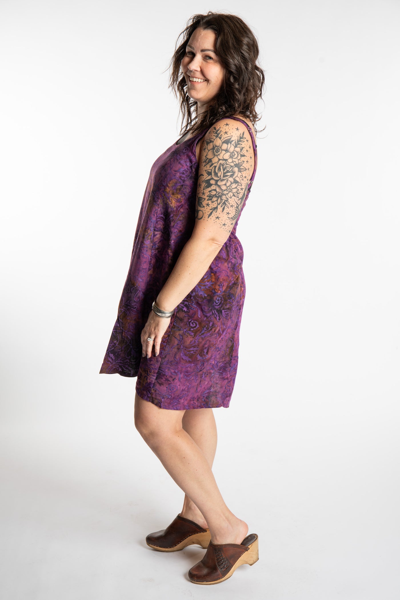 Morgan is wearing the Purple Paradise Surya Batik Sundress in size M 