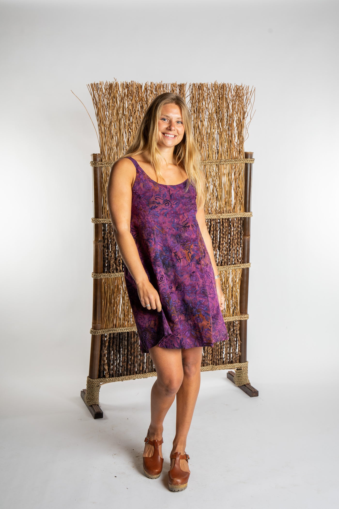 Sophie is wearing the Purple Paradise Surya Batik Sundress in size M 