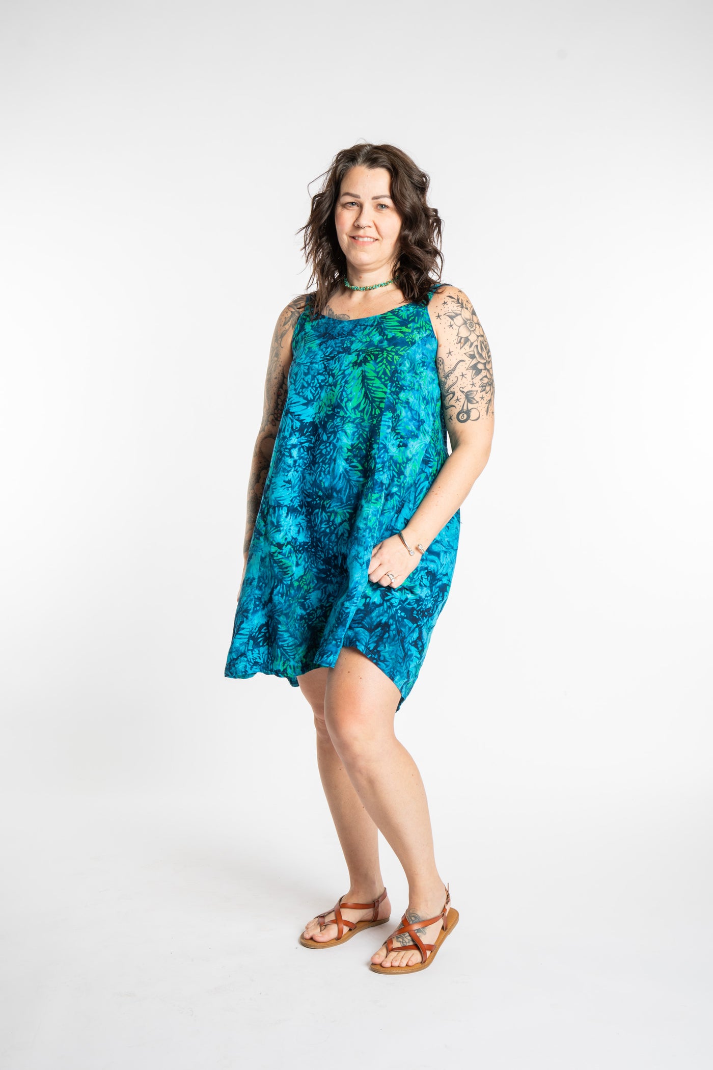 Morgan is wearing the Blue Undersea Surya Batik Sundress in size M 