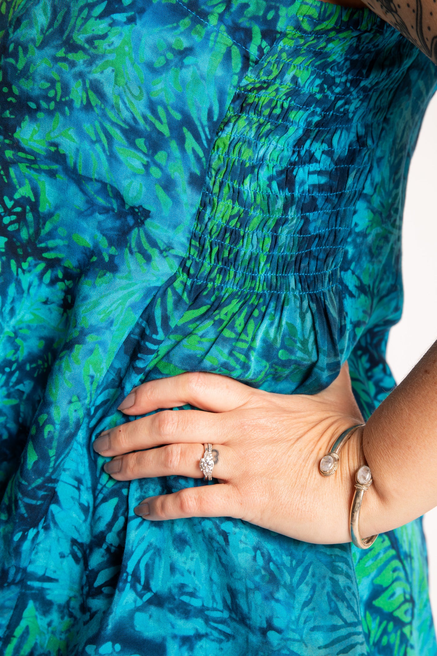 Morgan is wearing the Blue Undersea Surya Batik Sundress in size M 