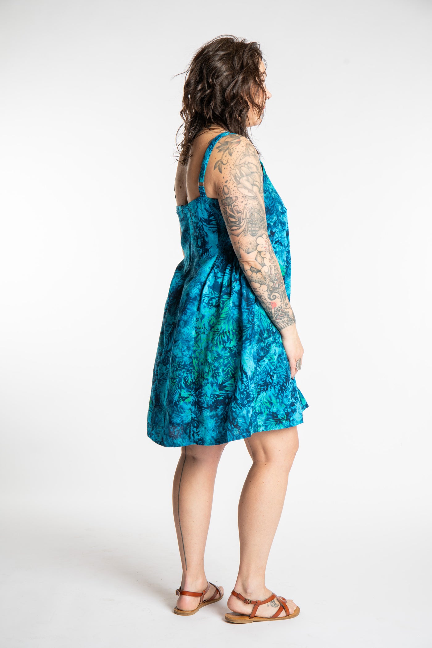 Morgan is wearing the Blue Undersea Surya Batik Sundress in size M 
