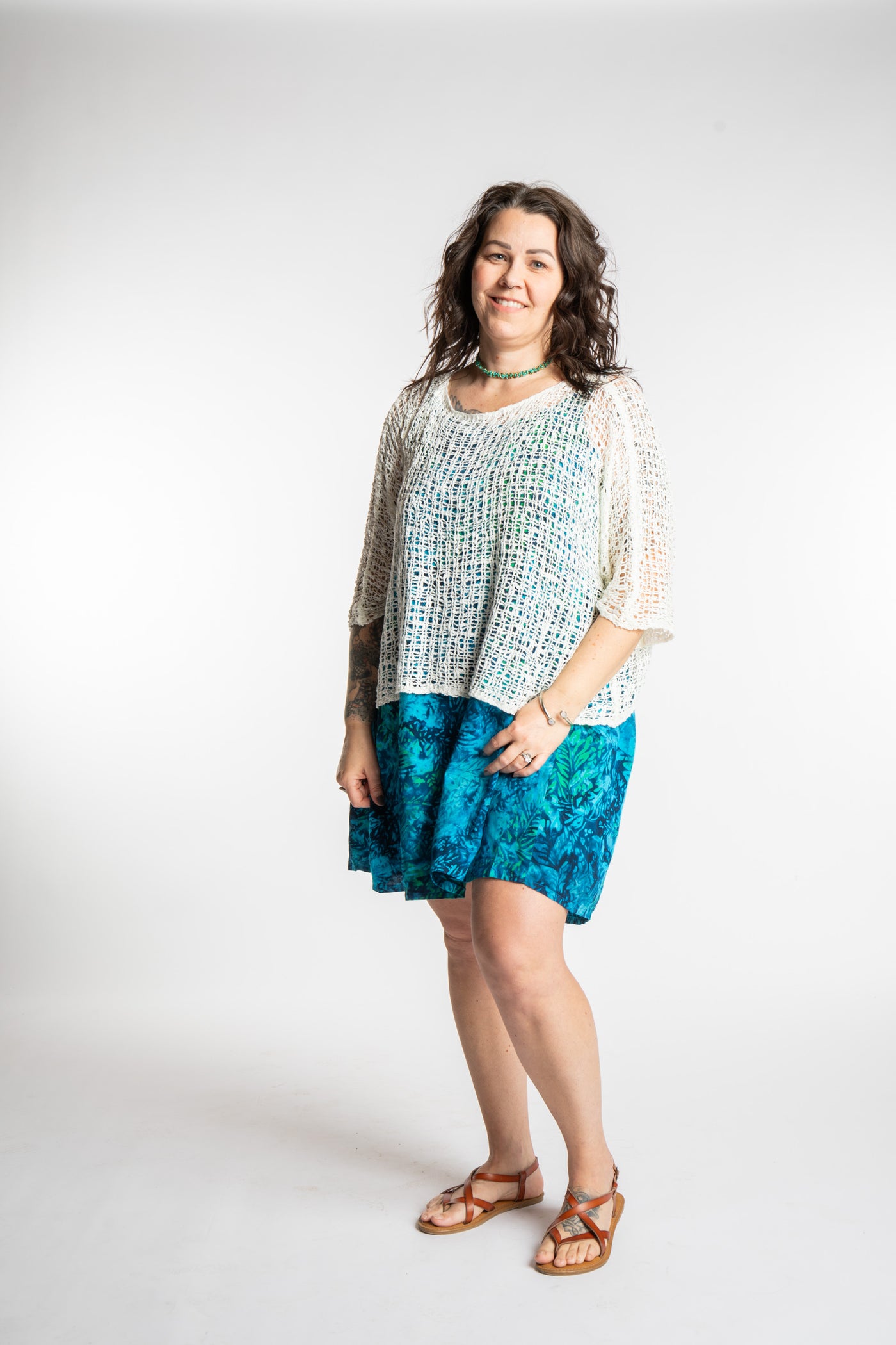 Morgan is wearing the Blue Undersea Surya Batik Sundress in size M 