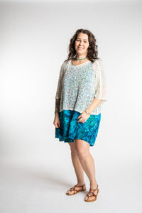Morgan is wearing the Blue Undersea Surya Batik Sundress in size M 