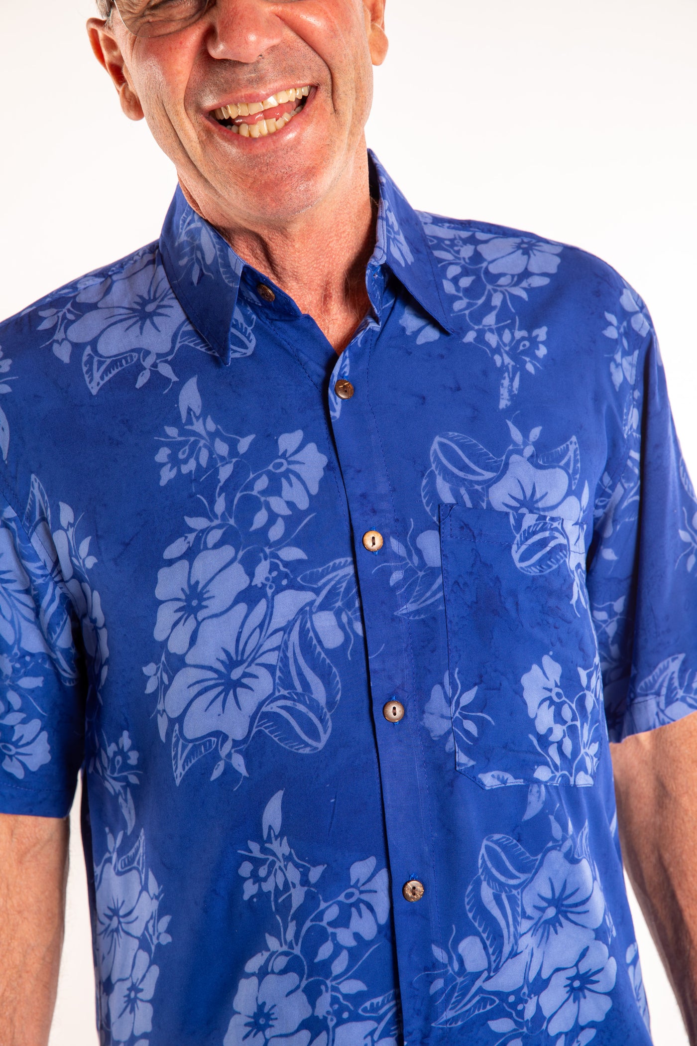 Ross wearing a M blue floral batik shirt in Cobalt