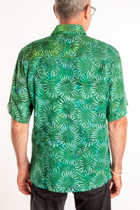 Ross wearing a M green floral batik shirt in Forest Green