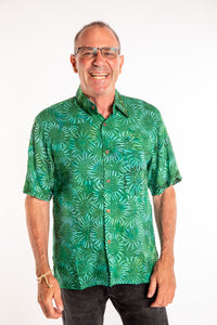 Ross wearing a M green floral batik shirt in Forest Green