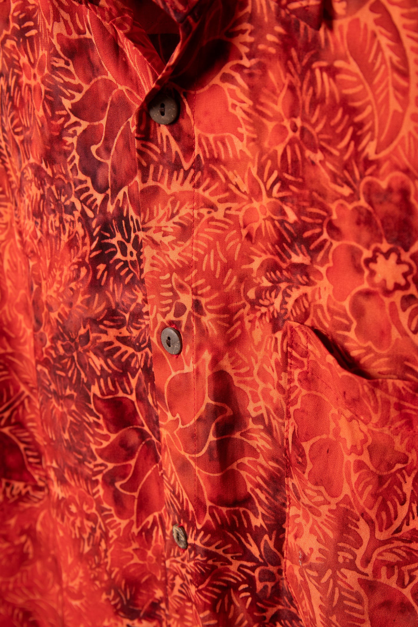Red patterned batik shirt in Persimmon