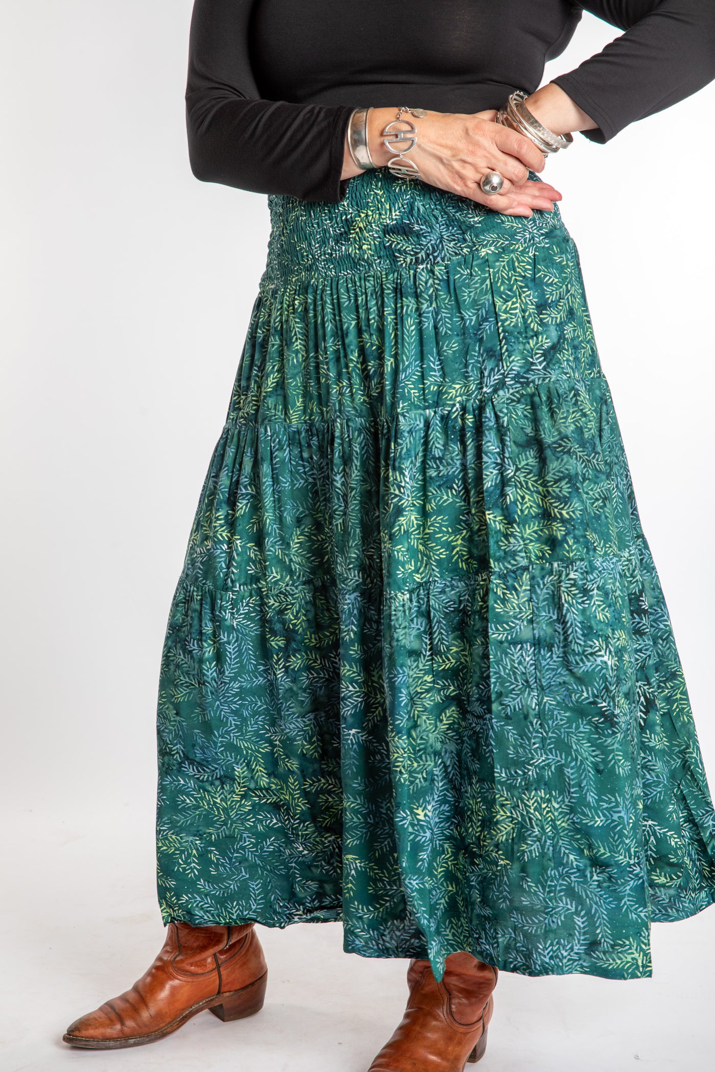 Susan wearing a S/M colorful patterned batik prairie skirt in Forest Green