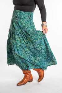 Susan wearing a S/M colorful patterned batik prairie skirt in Forest Green