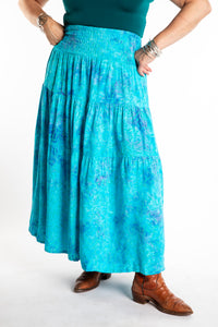 Susan wearing a S/M colorful patterned batik prairie skirt in Sky Blue
