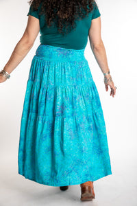 Susan wearing a S/M colorful patterned batik prairie skirt in Sky Blue