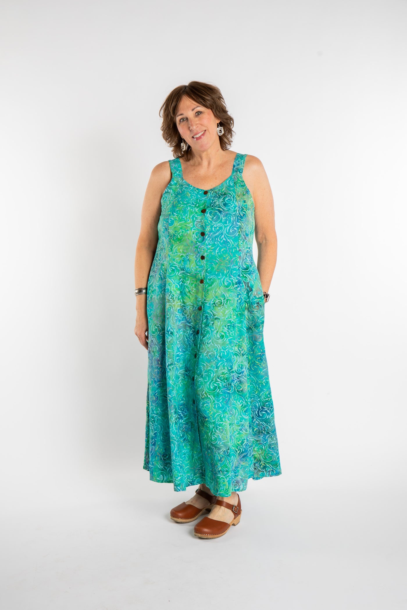 Betty is wearing the Bright Teal Ani Button Batik Maxi Dress in size M