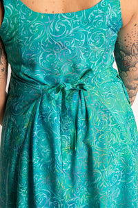 Morgan is wearing the Bright Teal Ani Button Batik Maxi Dress in size M