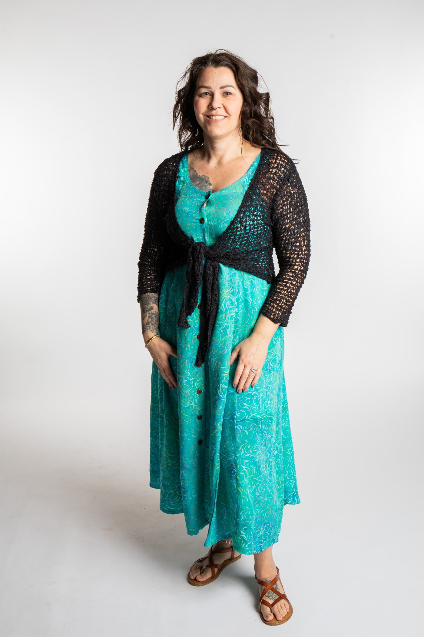 Morgan is wearing the Bright Teal Ani Button Batik Maxi Dress in size M