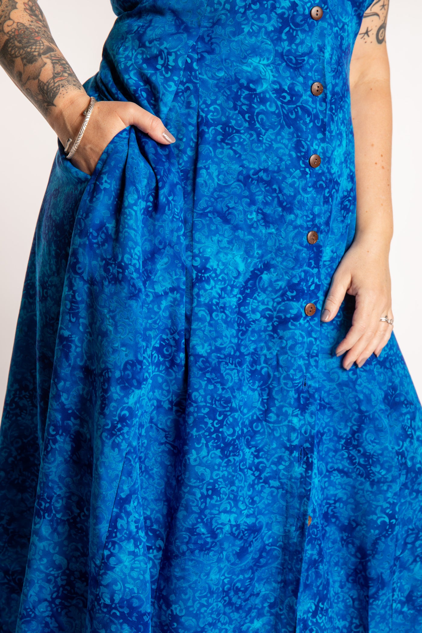 Morgan is wearing the Cobalt Blue Ani Button Batik Maxi Dress in size M
