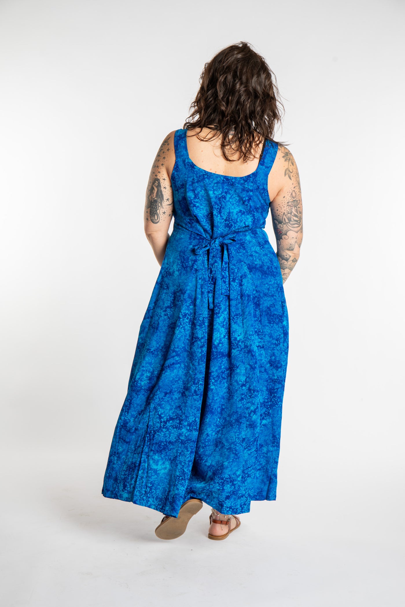 Morgan is wearing the Cobalt Blue Ani Button Batik Maxi Dress in size M