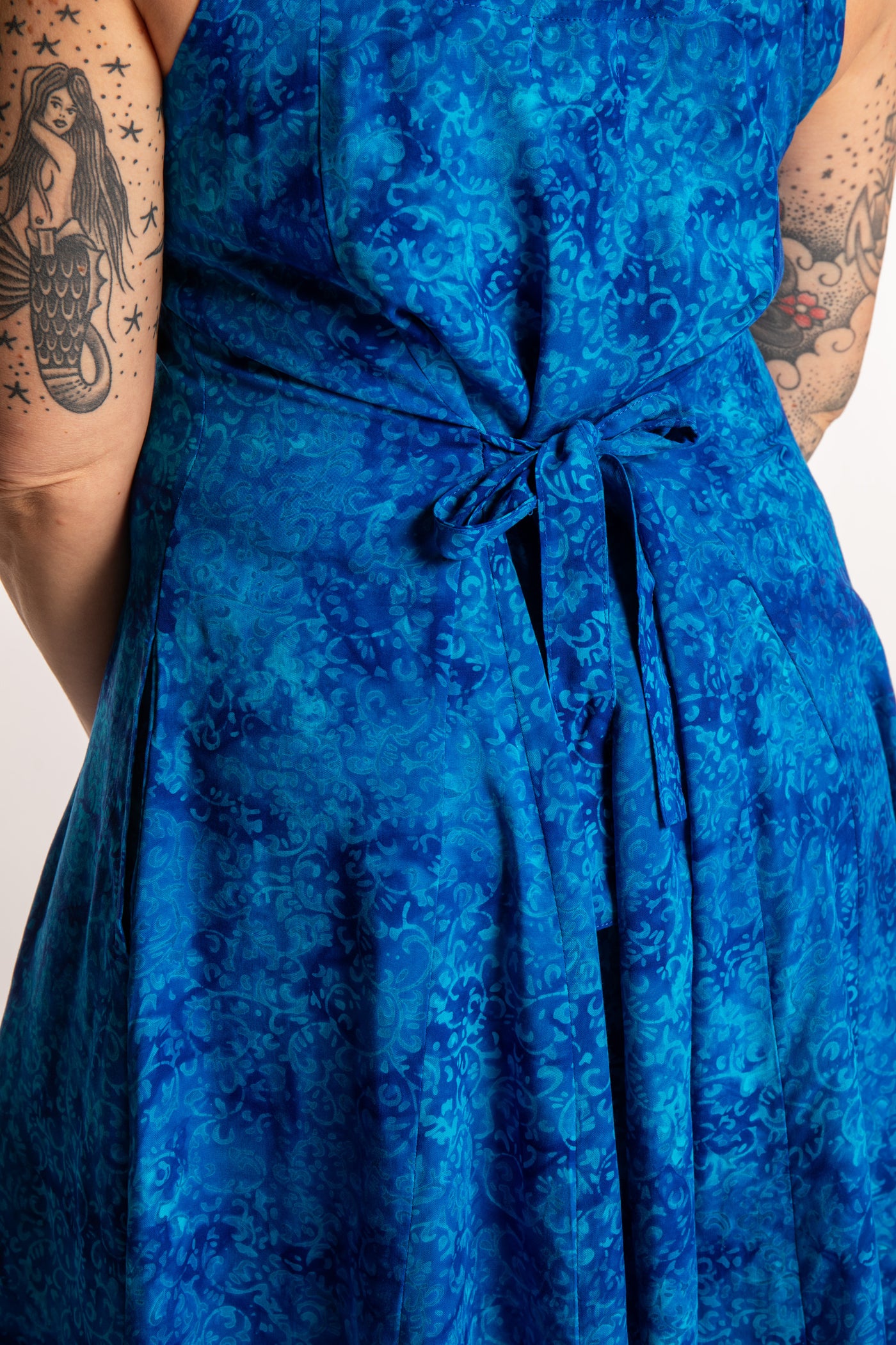 Morgan is wearing the Cobalt Blue Ani Button Batik Maxi Dress in size M