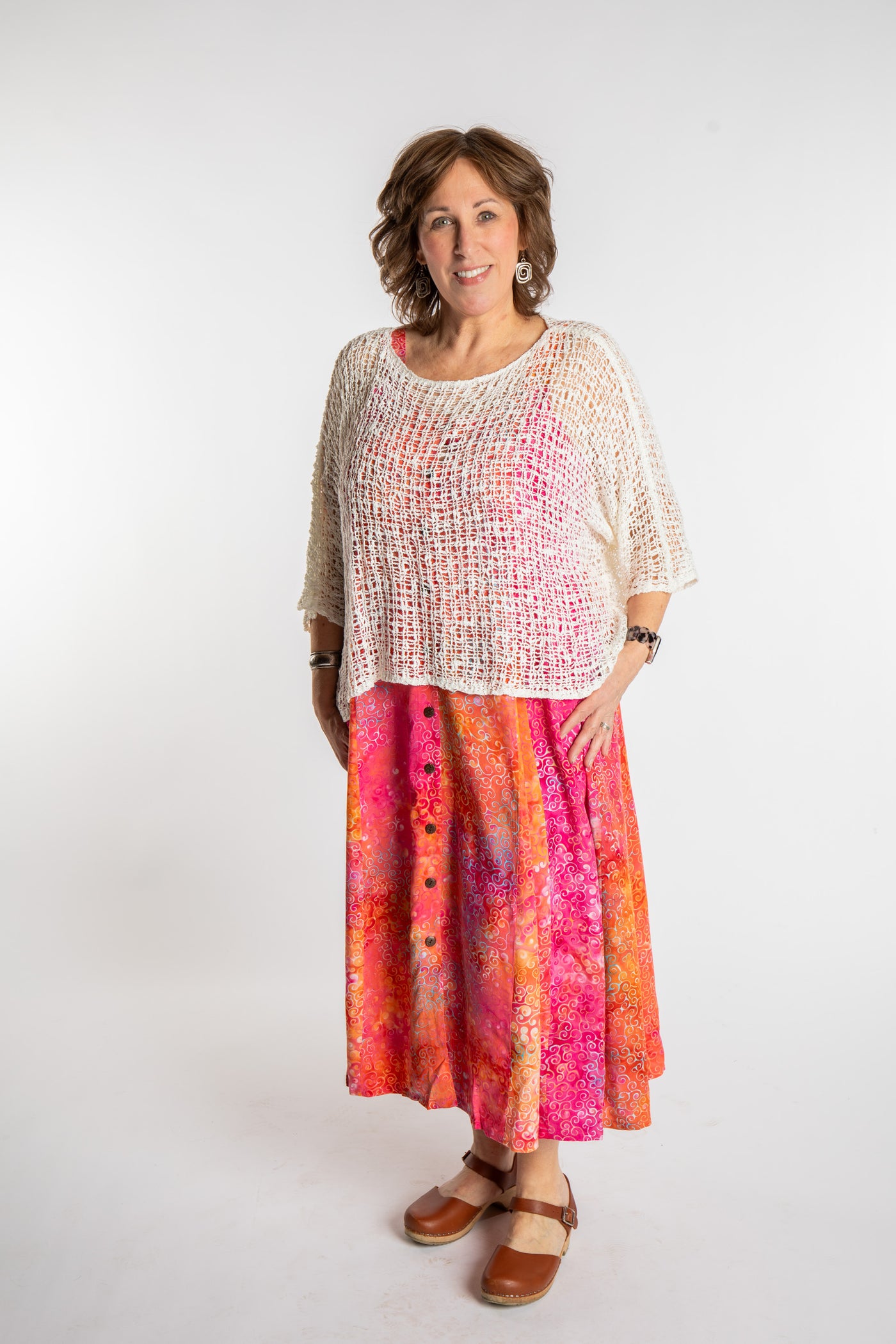 Betty is wearing the Sunkissed Coral Pink Ani Button Batik Maxi Dress in size L