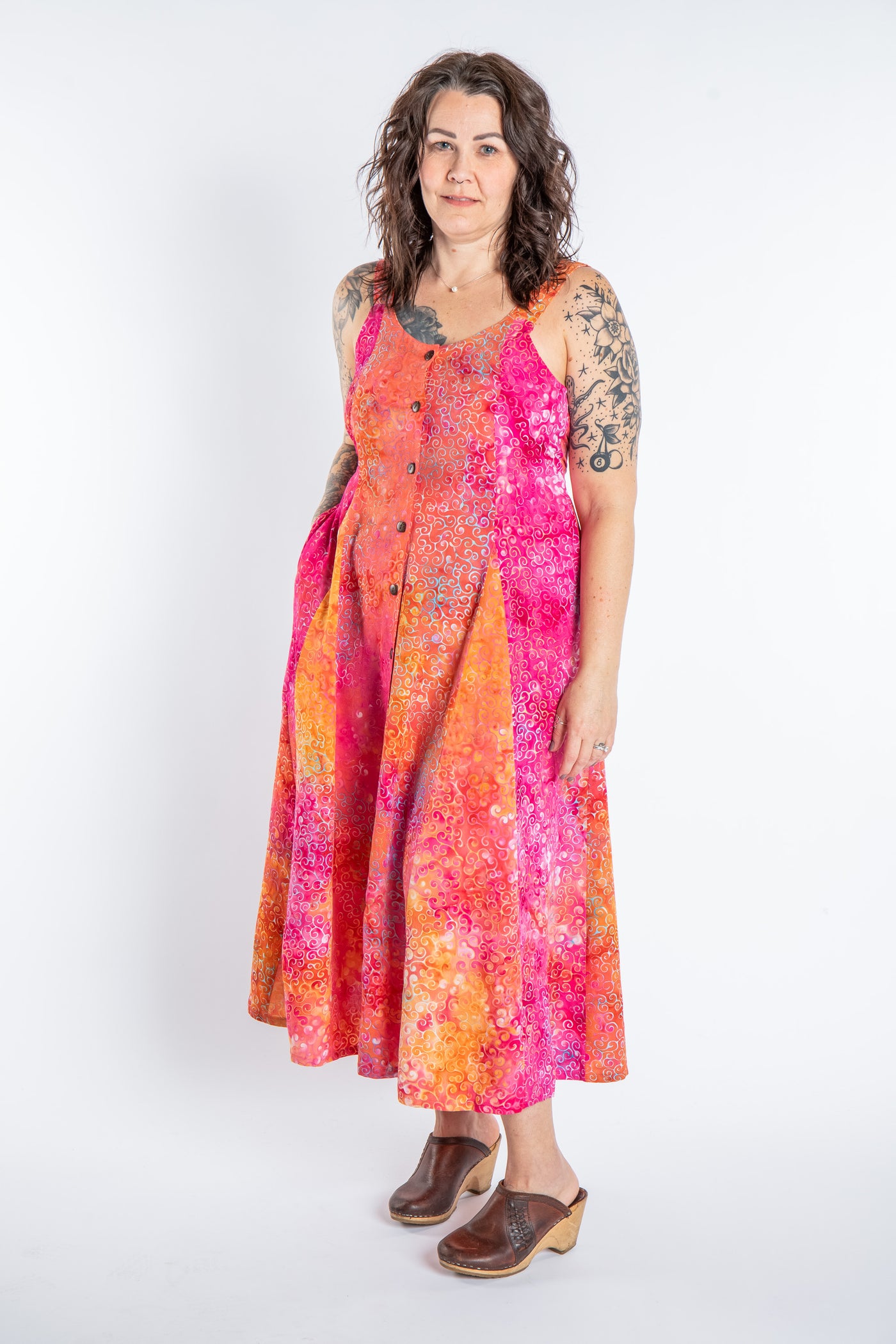 Morgan is wearing the Sunkissed Coral Pink Ani Button Batik Maxi Dress in size M