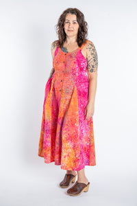 Morgan is wearing the Sunkissed Coral Pink Ani Button Batik Maxi Dress in size M