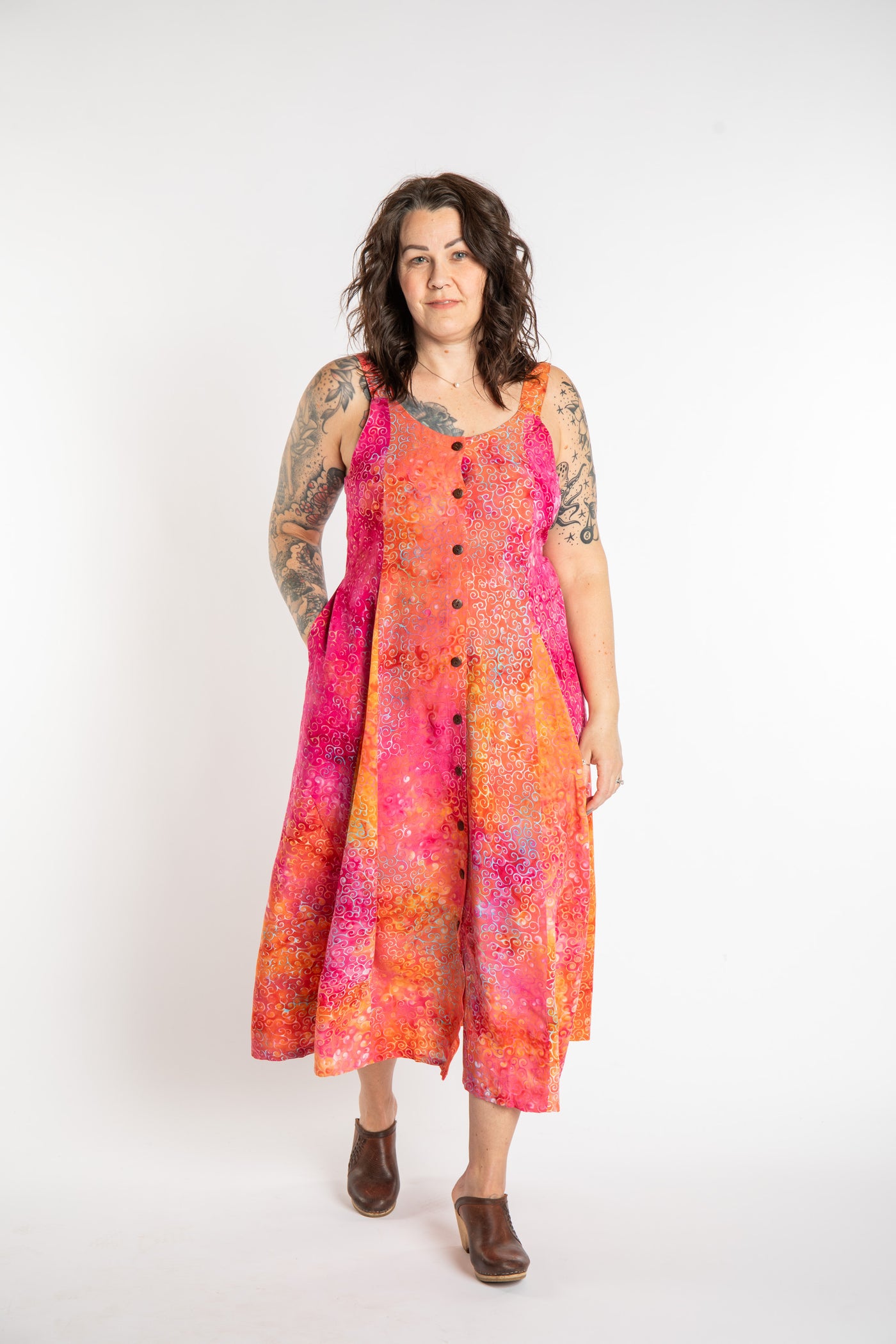 Morgan is wearing the Sunkissed Coral Pink Ani Button Batik Maxi Dress in size M