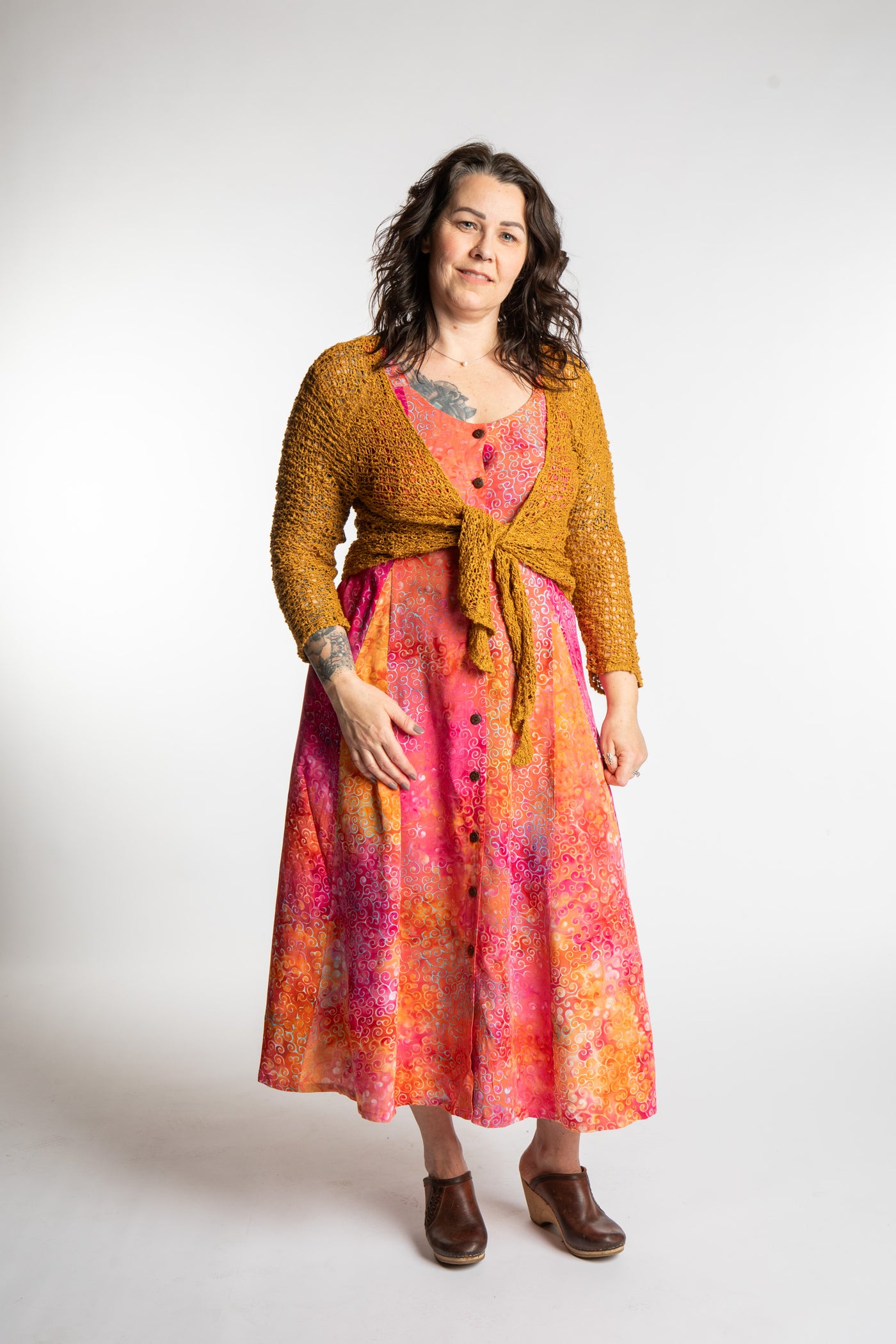 Morgan is wearing the Sunkissed Coral Pink Ani Button Batik Maxi Dress in size M