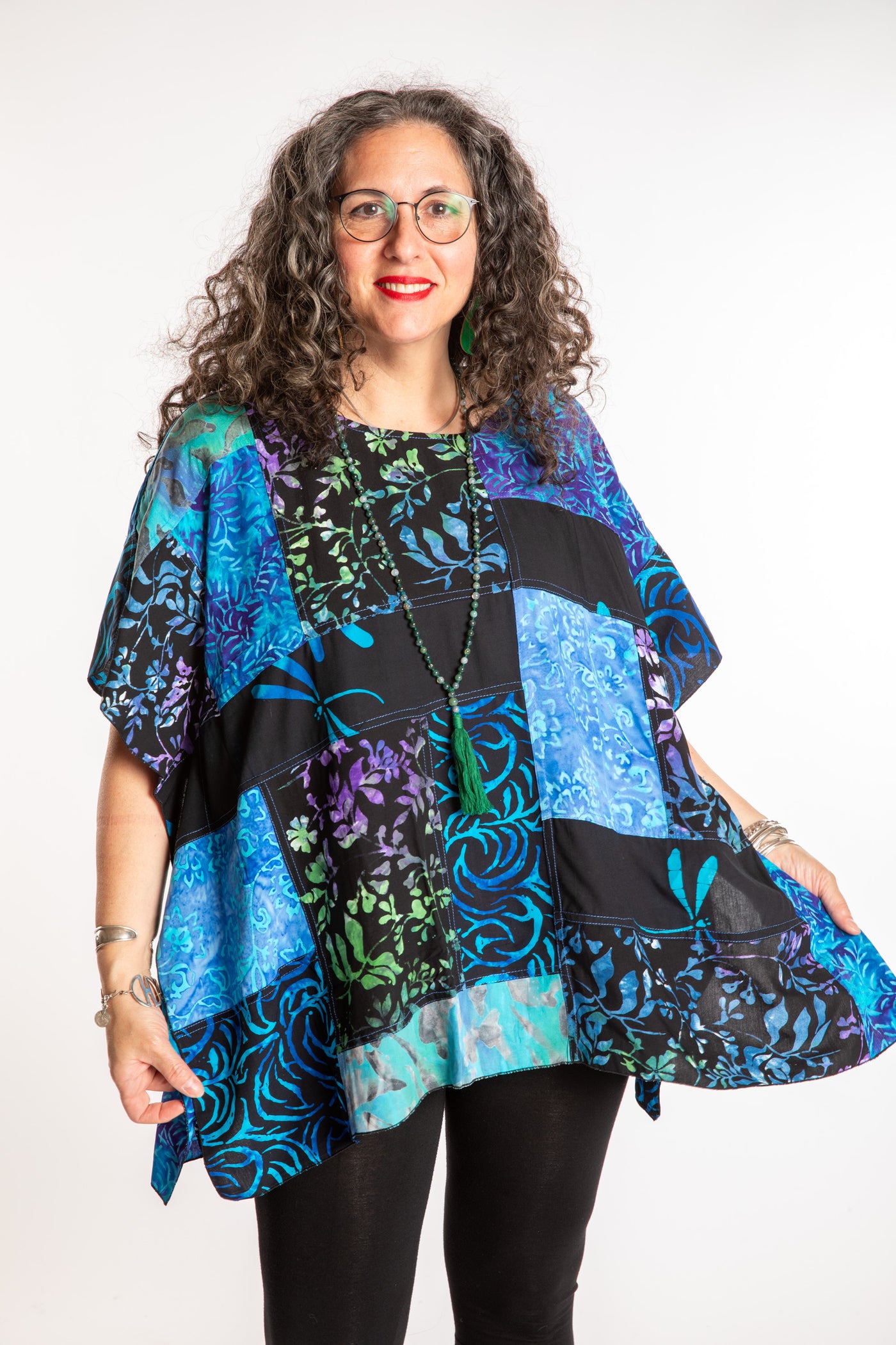 Susan is wearing the S/M Blue patchwork batik top