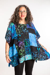 Susan is wearing the S/M Blue patchwork batik top
