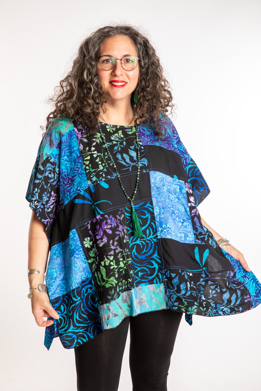 Susan is wearing the S/M Blue patchwork batik top