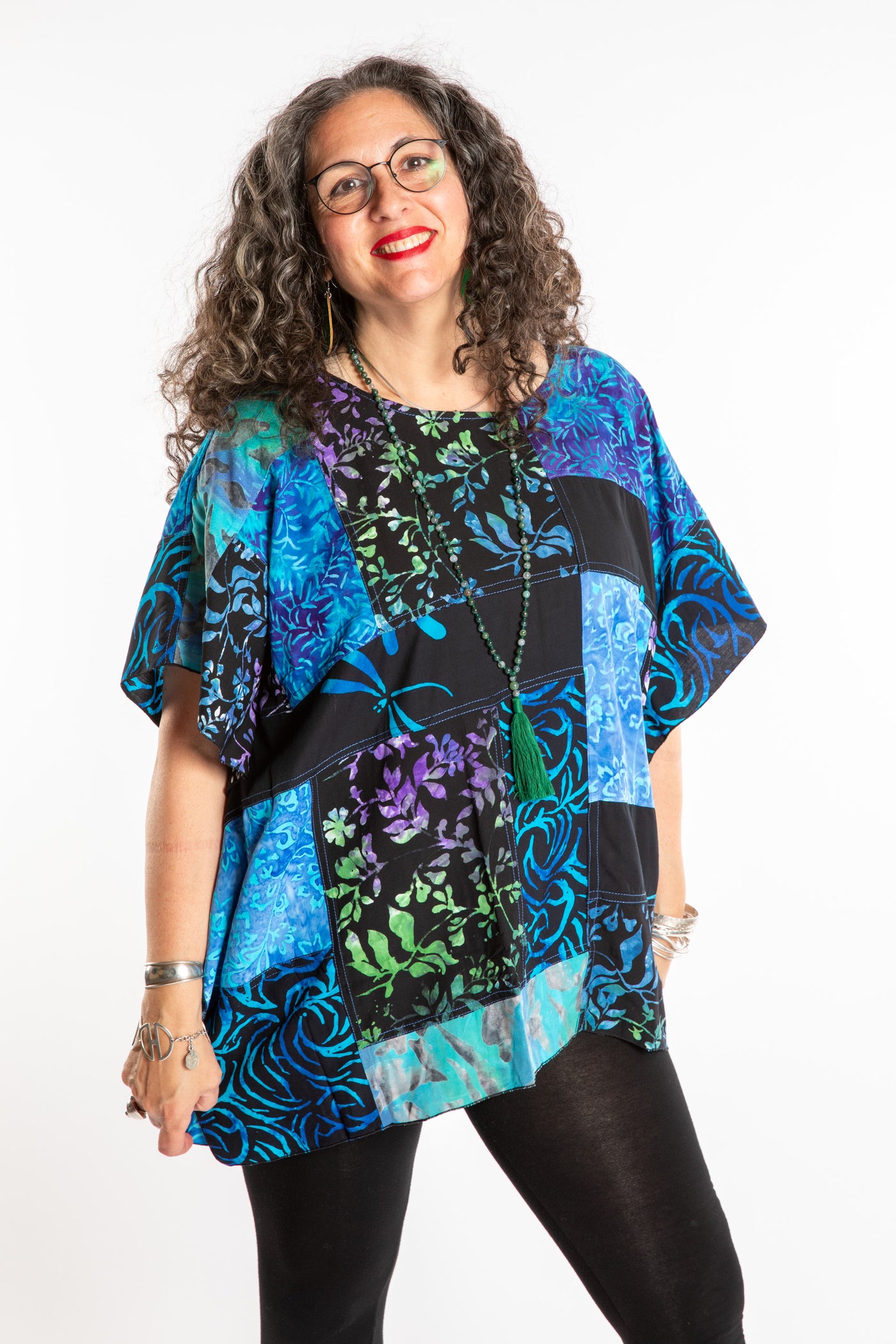Susan is wearing the S/M Blue patchwork batik top
