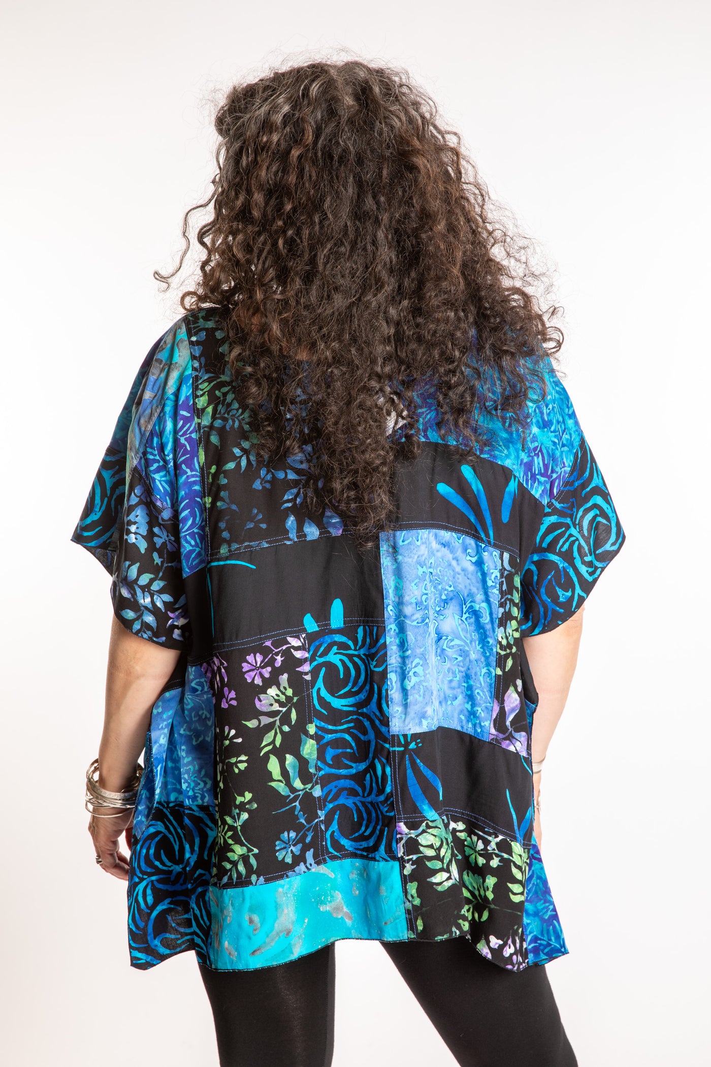 Susan is wearing the S/M Blue patchwork batik top