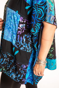 Susan is wearing the S/M Blue patchwork batik top