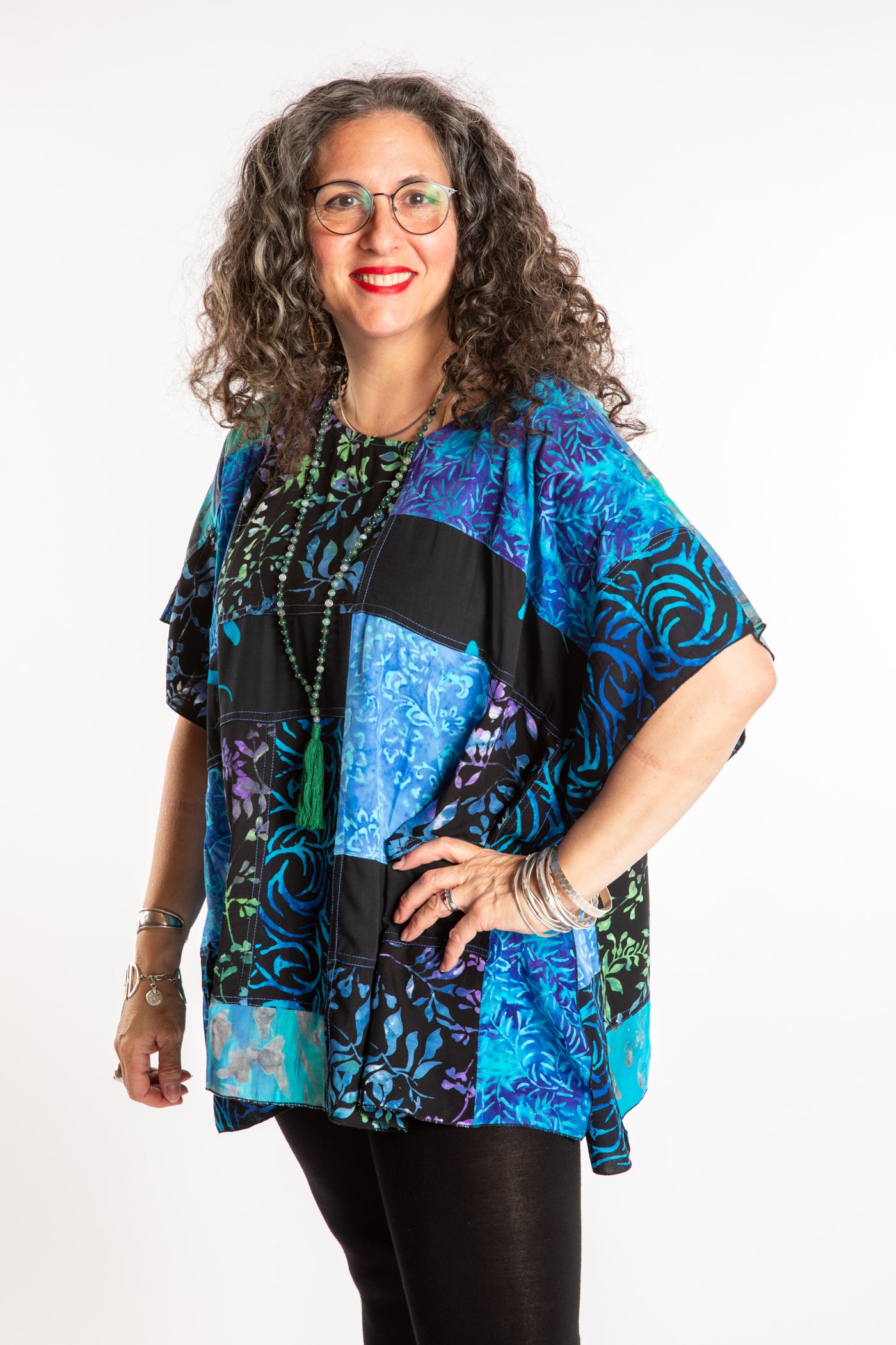 Susan is wearing the S/M Blue patchwork batik top