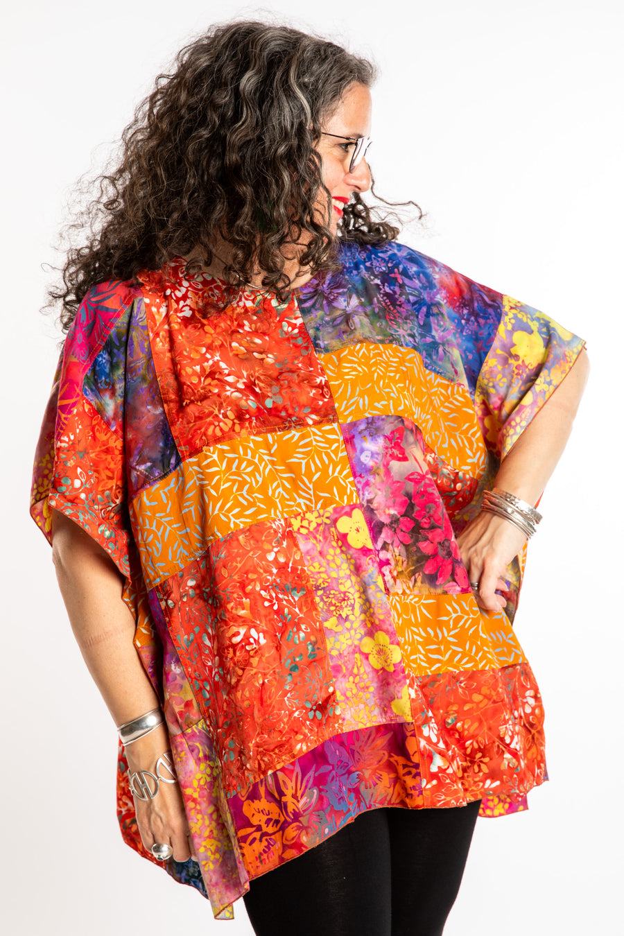 Susan is wearing the S/M orange patchwork batik top in Rose