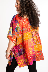 Susan is wearing the S/M orange patchwork batik top in Rose