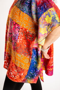 Susan is wearing the S/M orange patchwork batik top in Rose