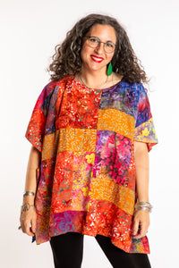 Susan is wearing the S/M orange patchwork batik top in Rose