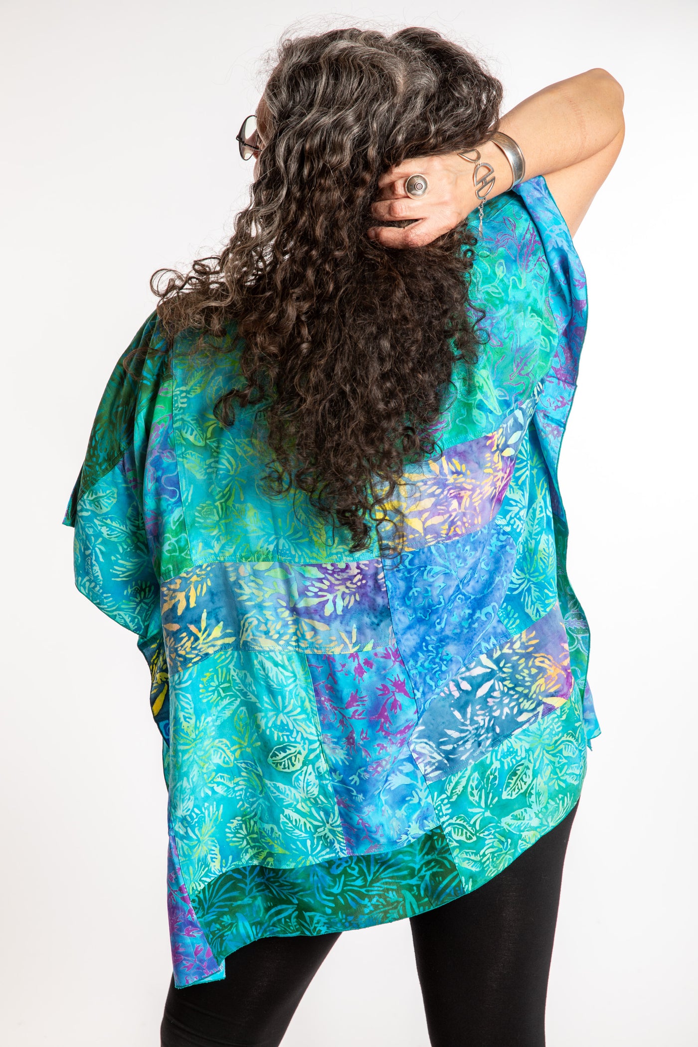 Susan is wearing the S/M Blue patchwork batik top in Turquoise